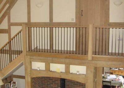 Image of a timber built staircase and fireplace