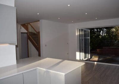 Image of a modern open living area with bi-fold doors