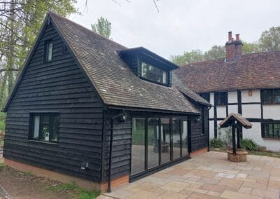 Image of a timber built extension to a listed property